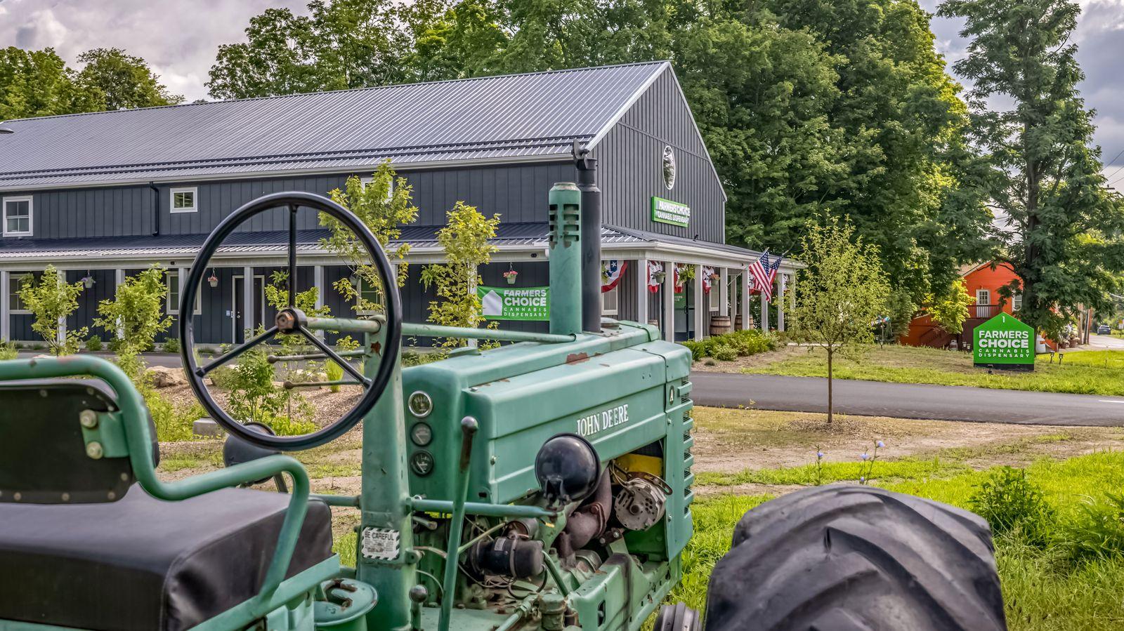 The barn interior of the New Paltz Farmers Choice with its marquee sign